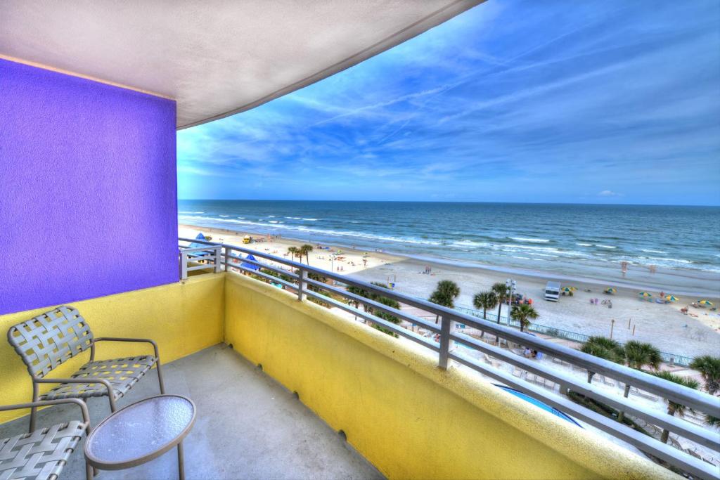 a balcony with a view of the beach at Wyndhams Ocean Walk Resort in Daytona Beach