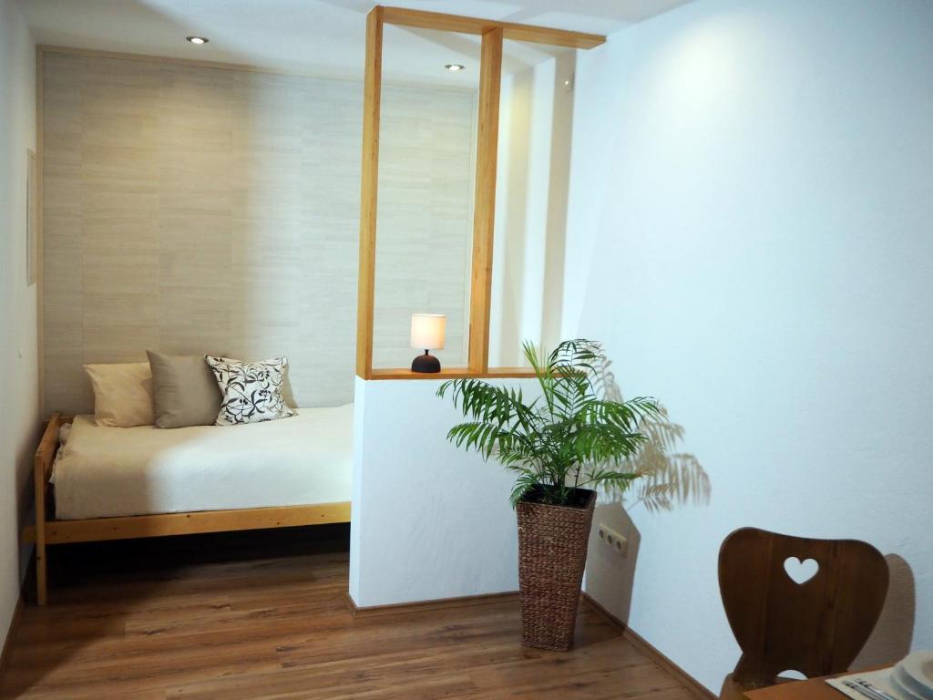Ένα ή περισσότερα κρεβάτια σε δωμάτιο στο Apartment Loidl Ebensee