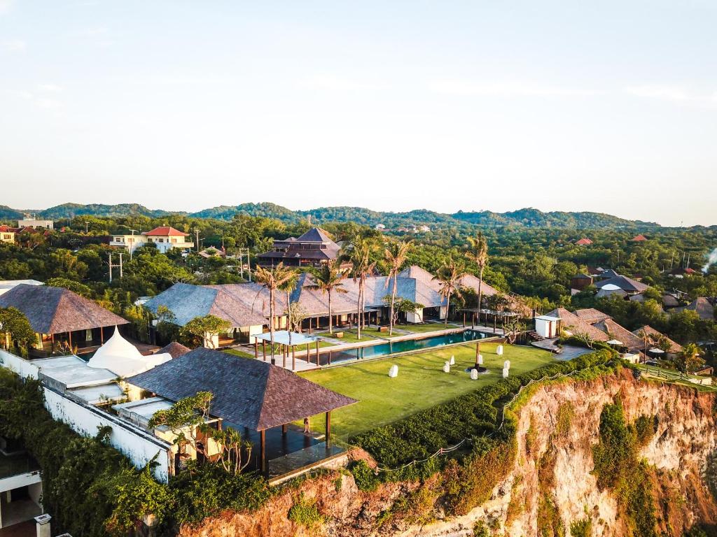 an aerial view of a house on a cliff at Detox and Spa Package - The Istana in Uluwatu