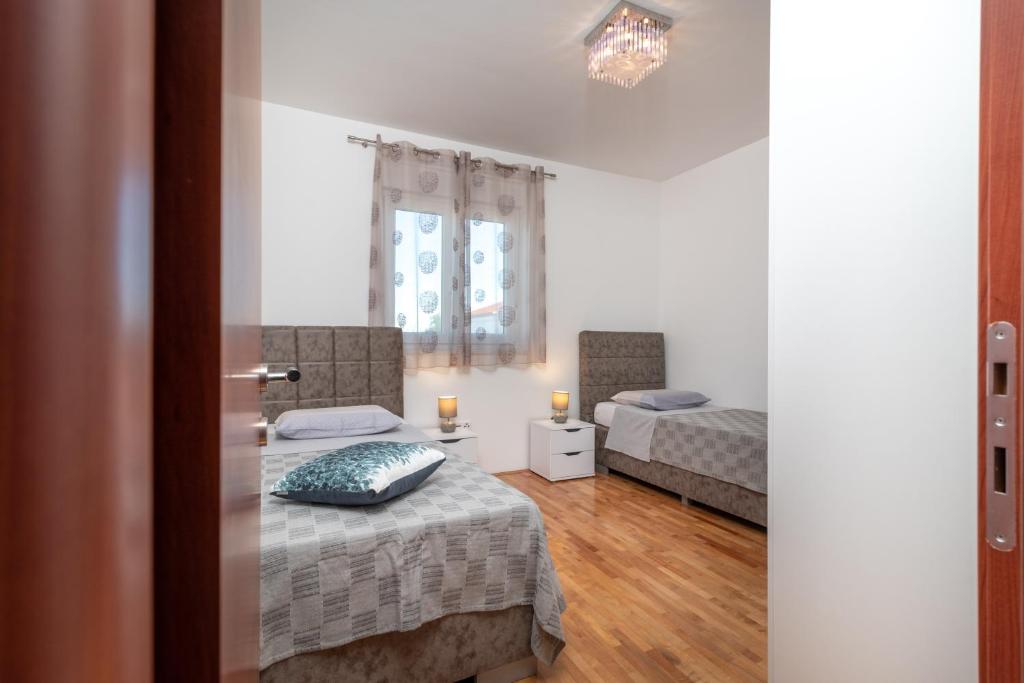 Posteľ alebo postele v izbe v ubytovaní Apartman Paty&Inky