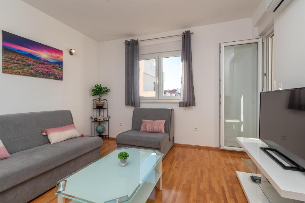 Televízia a/alebo spoločenská miestnosť v ubytovaní Apartman Paty&Inky