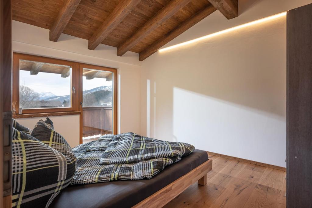 Letto o letti in una camera di Alpenchalet "DAHOAM"