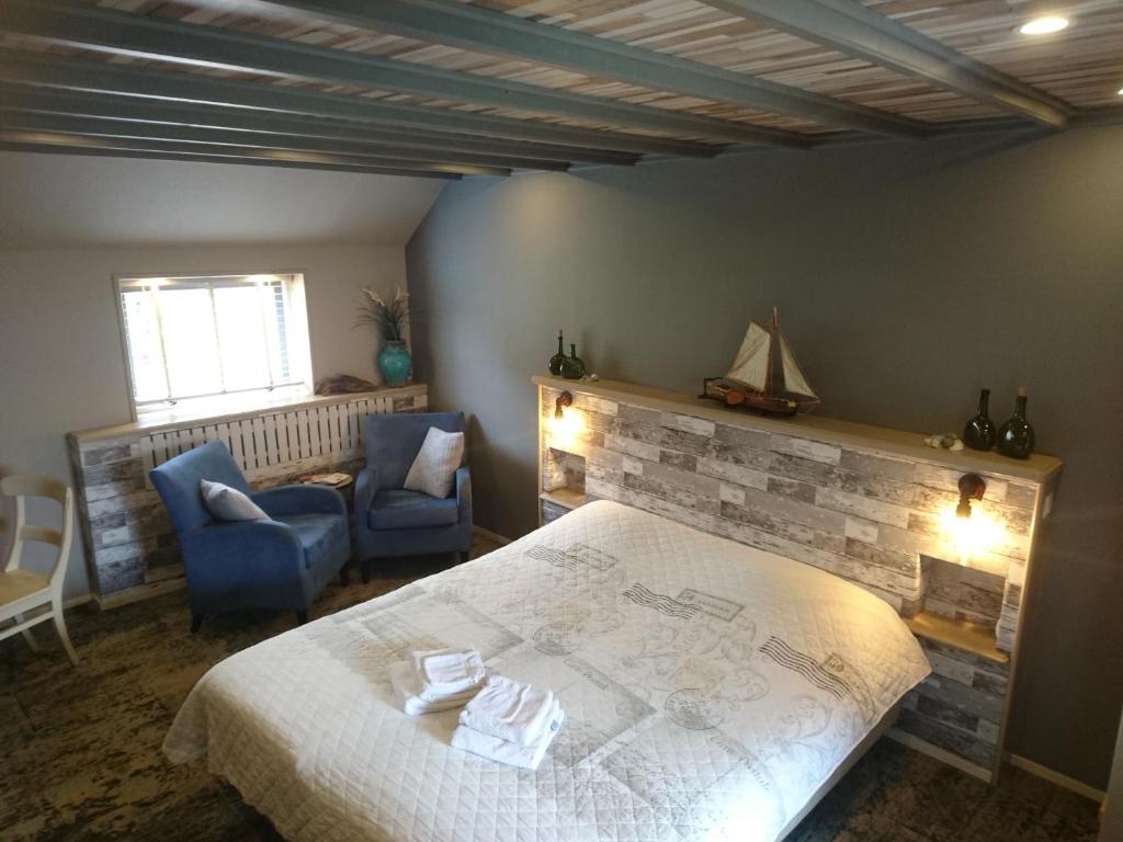 Postel nebo postele na pokoji v ubytování De Cyprian Bed & Breakfast