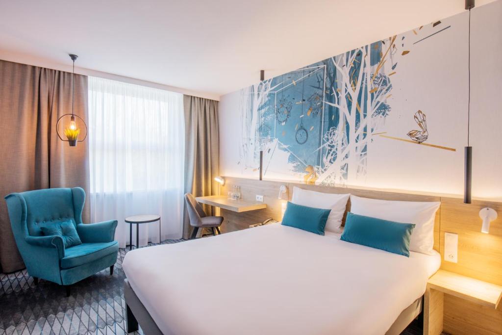 Postel nebo postele na pokoji v ubytování ibis Styles Kraków East