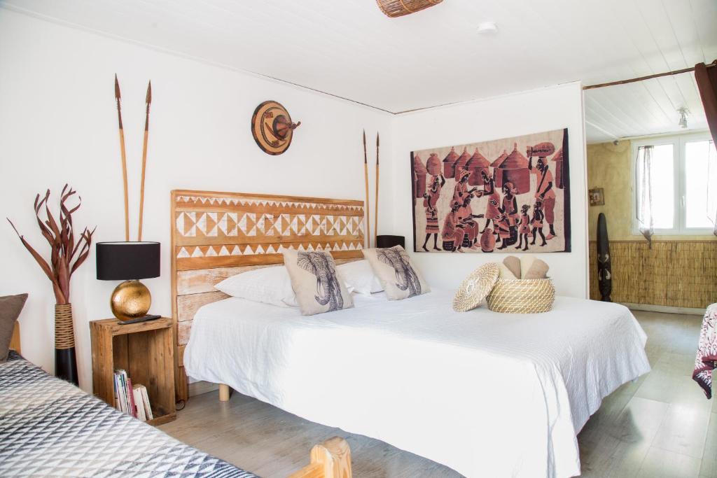 Postel nebo postele na pokoji v ubytování Maison d'hôtes L'îlot bambou