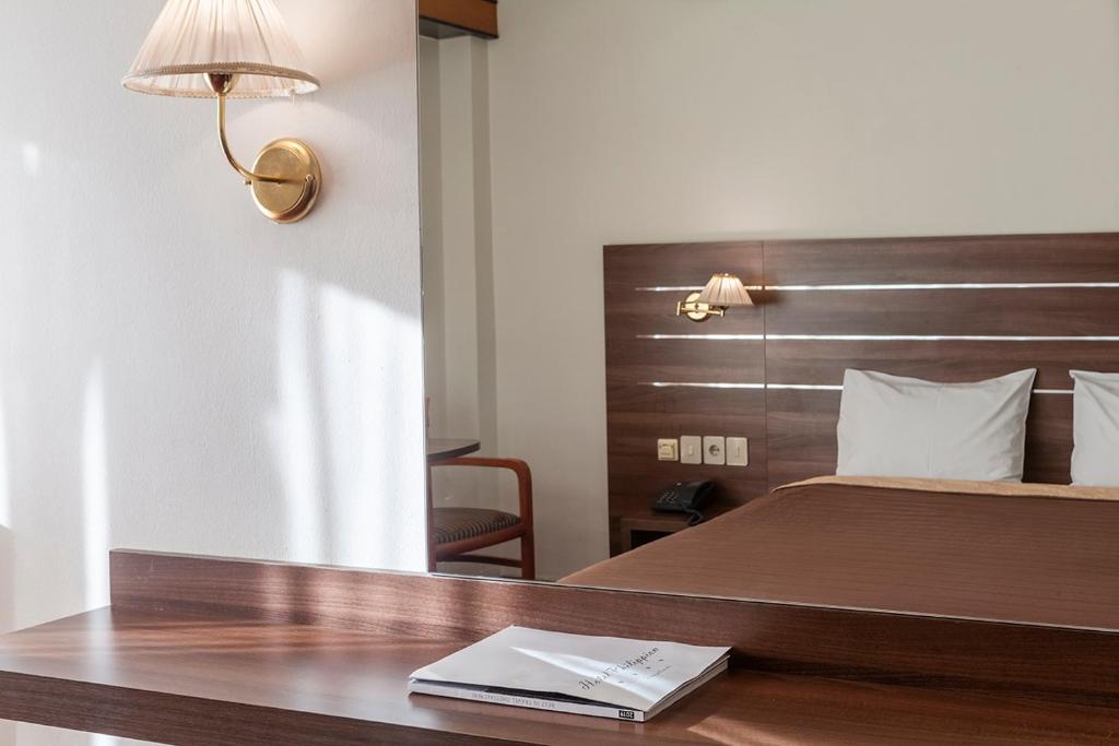 A bed or beds in a room at Philippion
