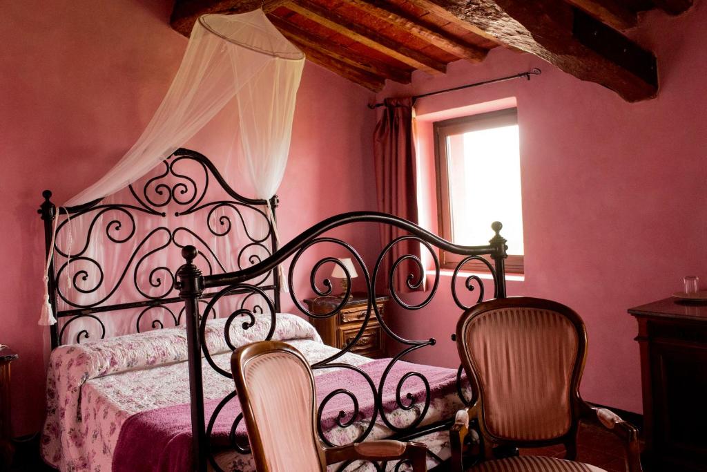 Postel nebo postele na pokoji v ubytování Relais I Castagnoni