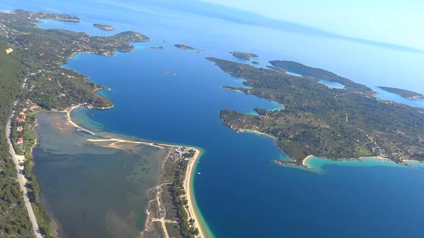 an aerial view of a group of islands and water at Kissos Apartments in Vourvourou