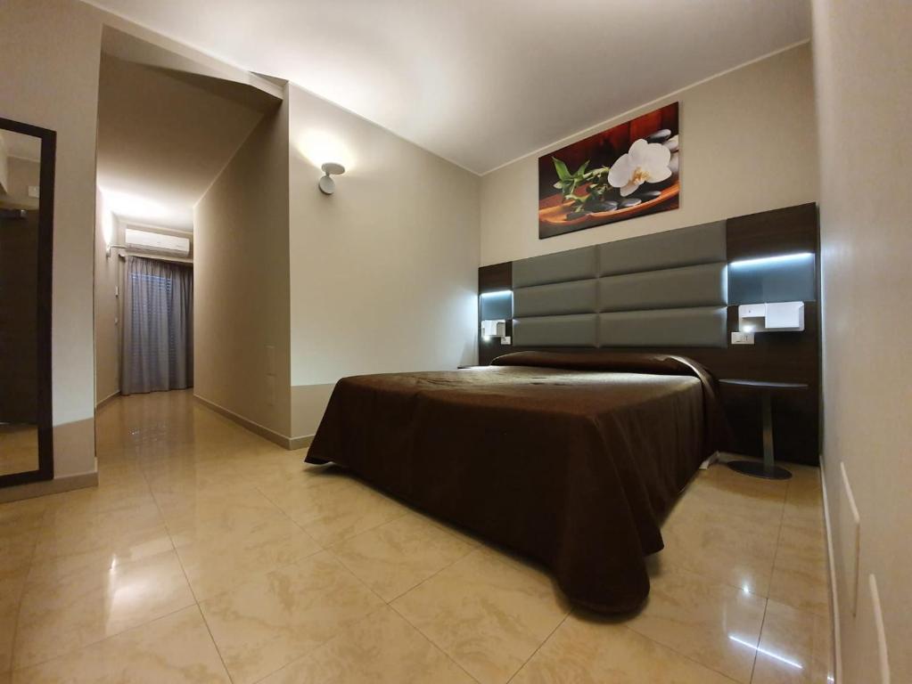 Postel nebo postele na pokoji v ubytování Hotel Casale dei Greci