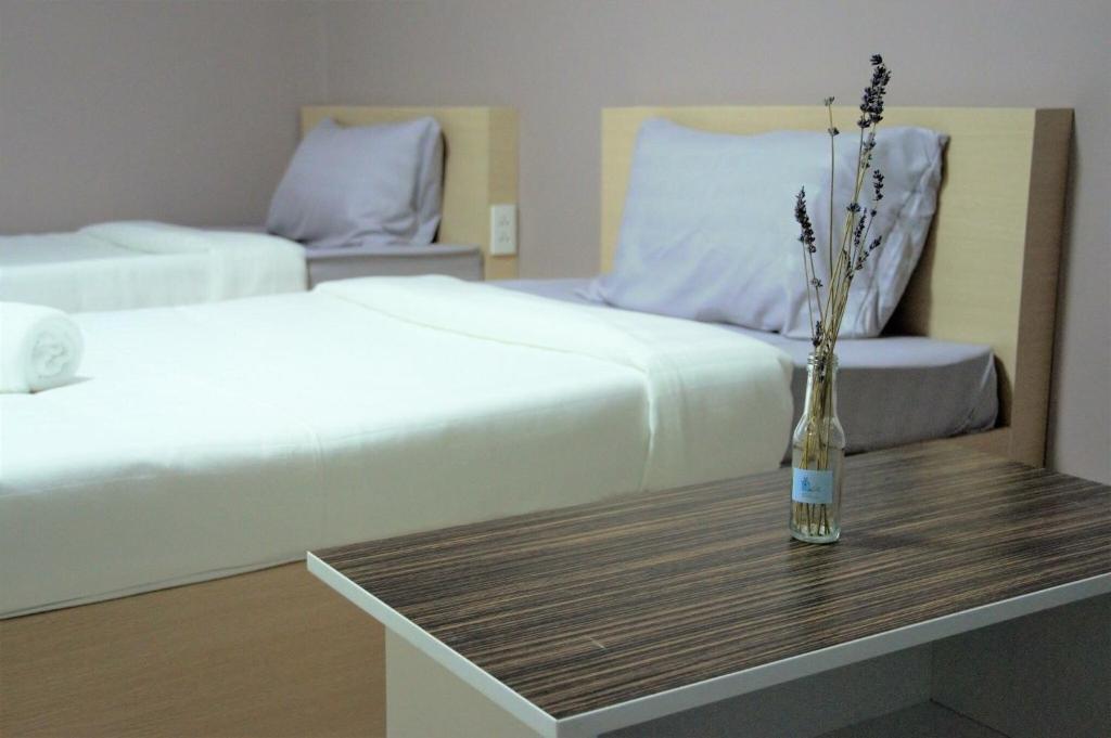 Postel nebo postele na pokoji v ubytování H12, The Stylish Apartment