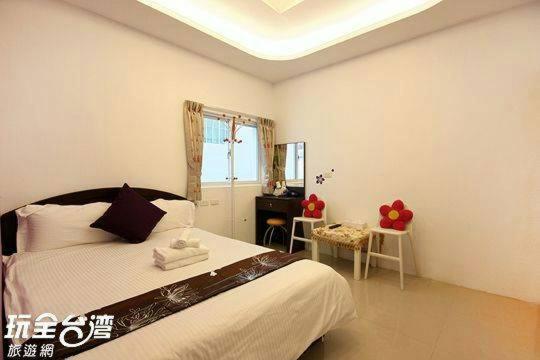 Postel nebo postele na pokoji v ubytování Nandian Homestay