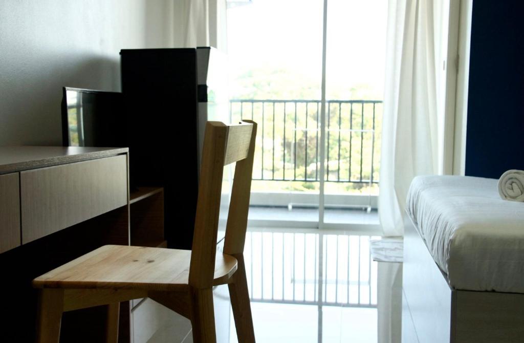 Postel nebo postele na pokoji v ubytování H12, The Stylish Apartment