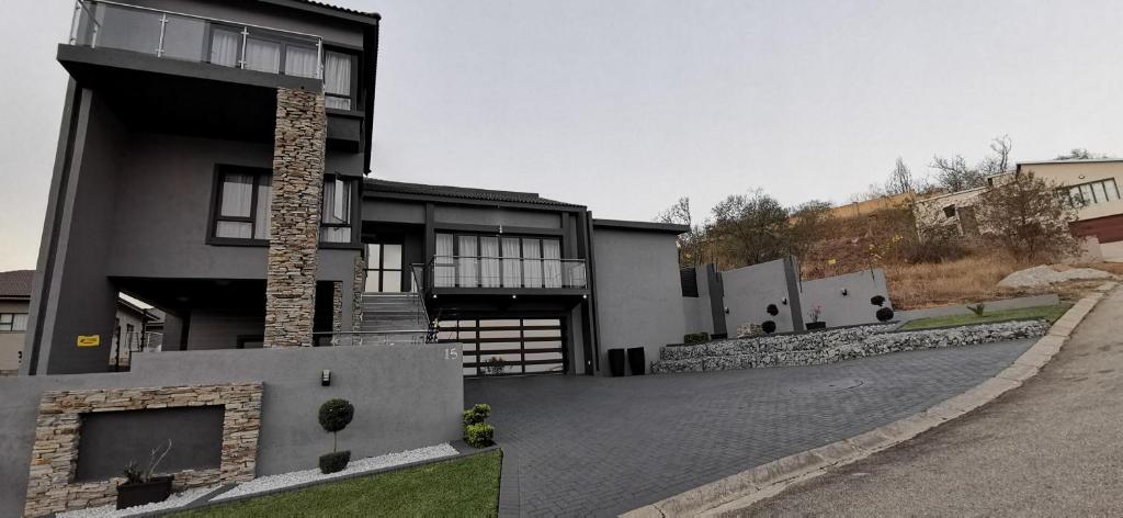 a large house with a driveway in front of it at Nolonger in operation in Nelspruit