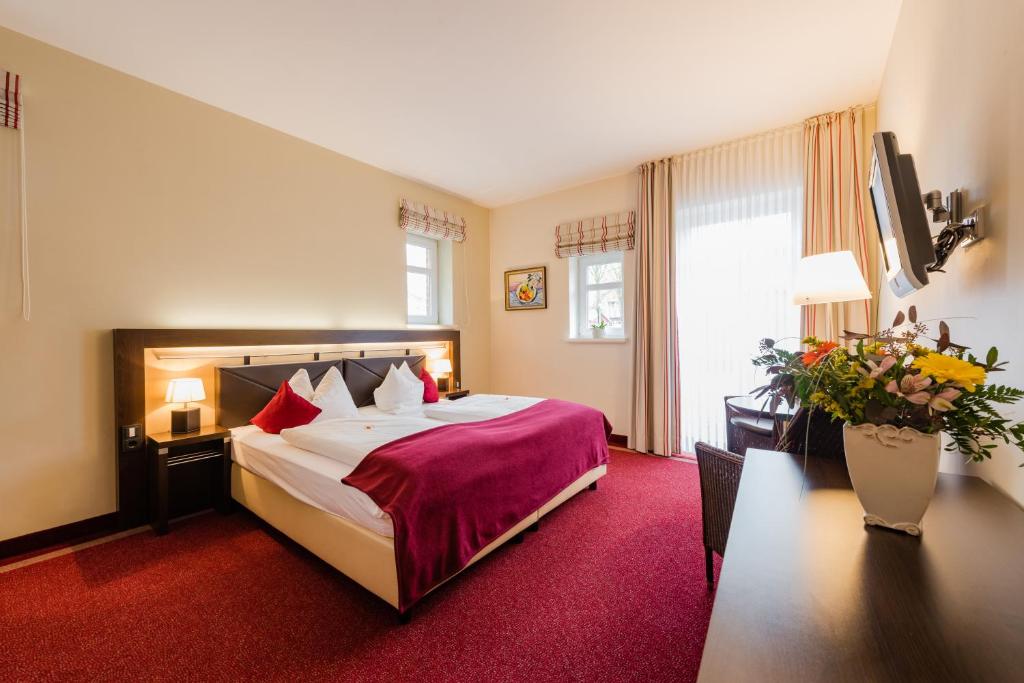 Postel nebo postele na pokoji v ubytování Hotel am Fischerhafen