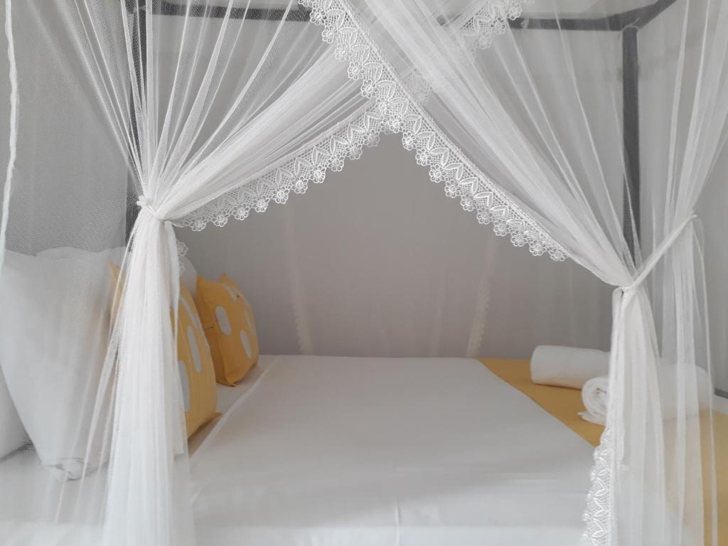 Postel nebo postele na pokoji v ubytování Apna Homestay Apartments