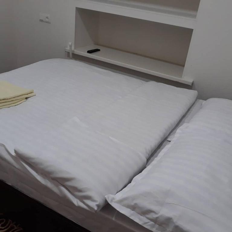 Postel nebo postele na pokoji v ubytování Azimut
