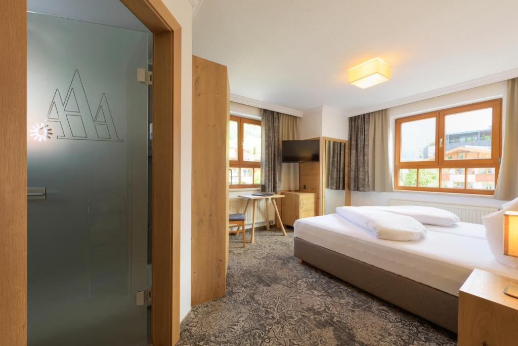 Postel nebo postele na pokoji v ubytování Aparthotel Acksteiner