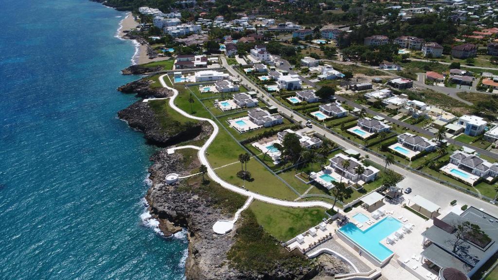 an aerial view of a resort next to the ocean at Ocean Village Deluxe Resort & Spa in Sosúa