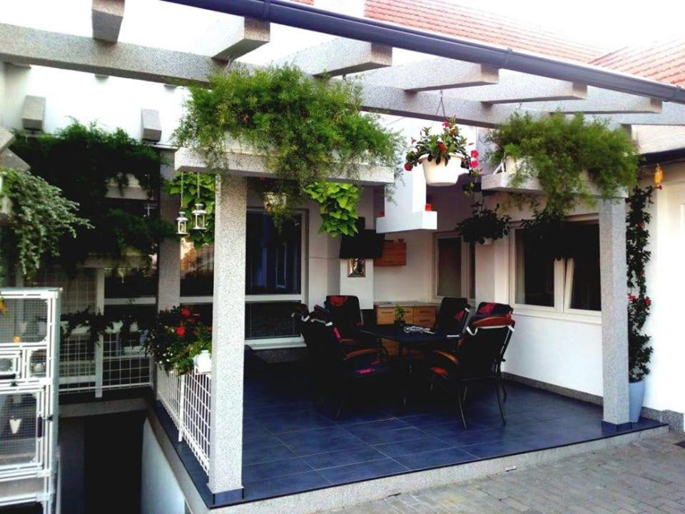 a patio with a table and chairs on a building at apartmán 2+1 in Huštěnovice