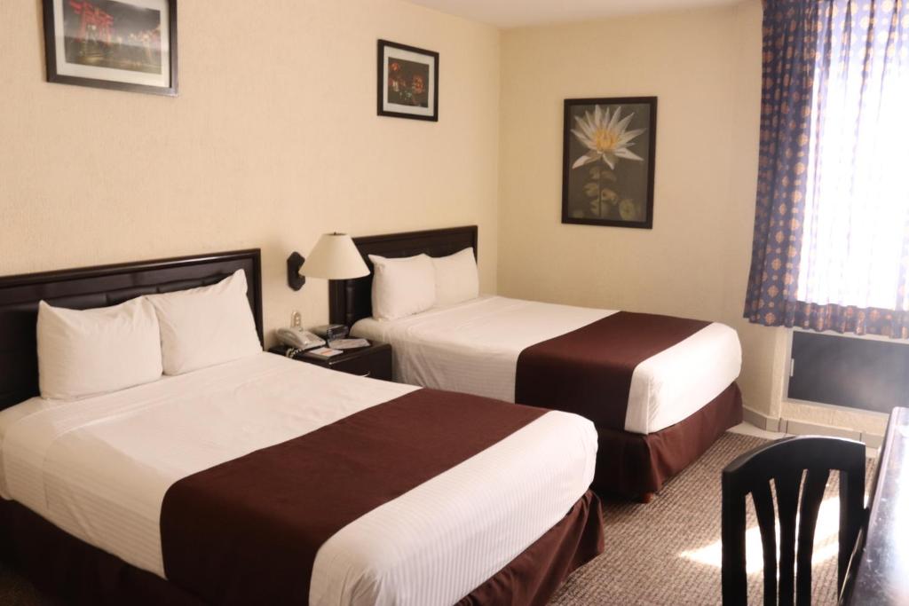 Postel nebo postele na pokoji v ubytování Hotel Santa Irene Guadalajara