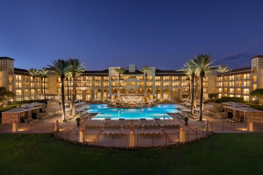 a hotel with a large pool in front of a building at Fairmont Scottsdale Princess in Scottsdale
