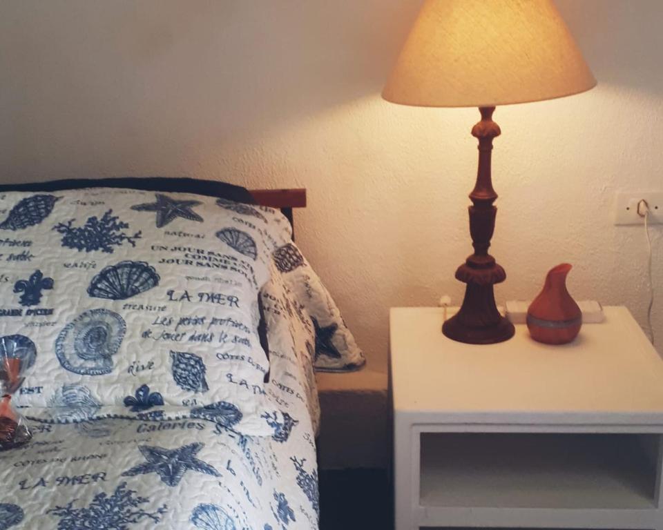 מיטה או מיטות בחדר ב-Suite Indiana Ilhabela