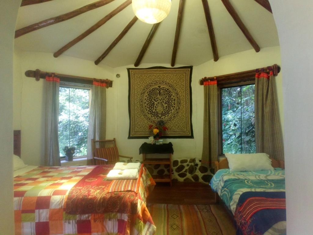 Postel nebo postele na pokoji v ubytování EColodge Ccatan