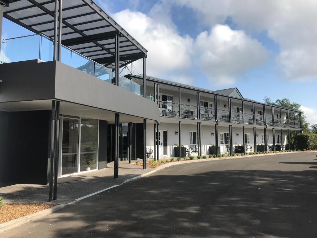a large white building with a lot of windows at Clouds Montville in Montville