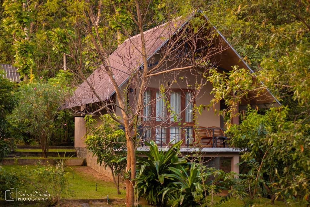 a house in the middle of a forest at Hantara Udawalawa in Udawalawe
