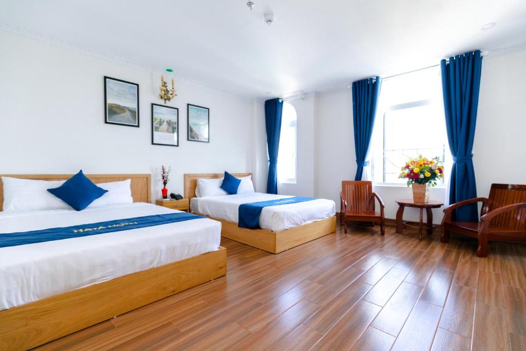 מיטה או מיטות בחדר ב-HaTa Hotel