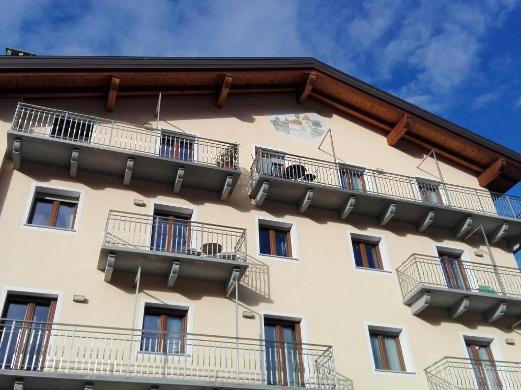 a building with balconies on the side of it at Appartamento Le Moulin in Aosta