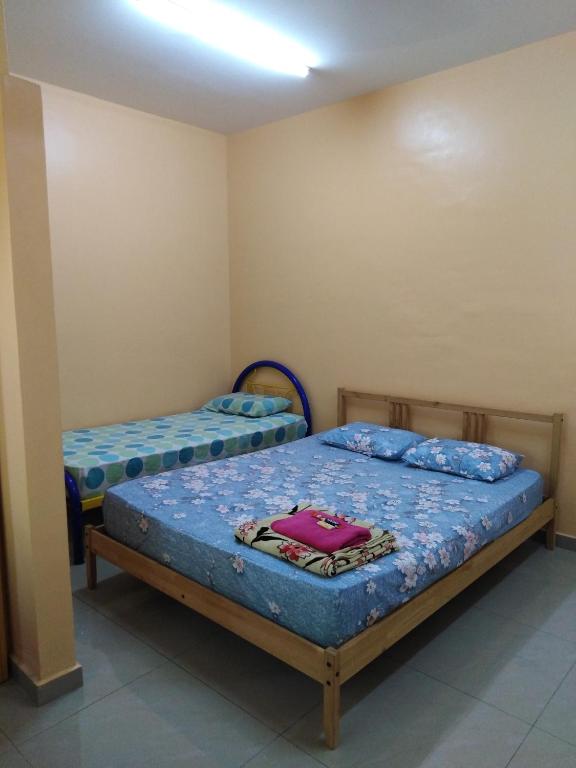 Postel nebo postele na pokoji v ubytování Homestay Teratak Umi Klang