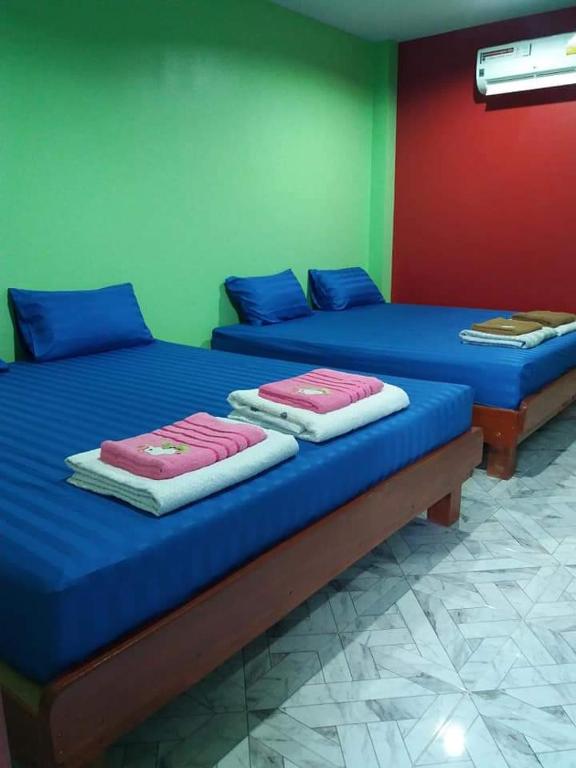 Postel nebo postele na pokoji v ubytování Yahle Villa เยห์เล่วิลล่า