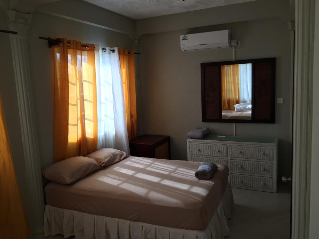 Postel nebo postele na pokoji v ubytování Atlantic Breeze Apartments, Canouan Island