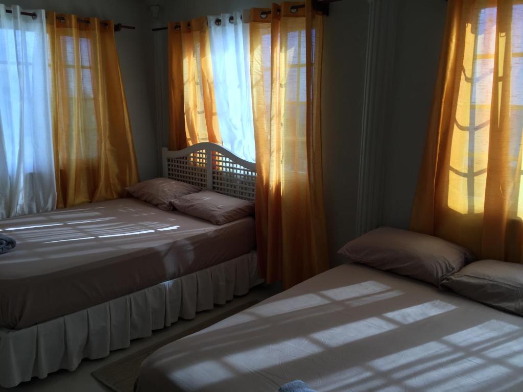 Postel nebo postele na pokoji v ubytování Atlantic Breeze Apartments, Canouan Island