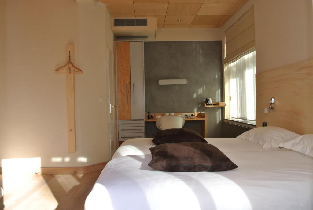 Postel nebo postele na pokoji v ubytování Asgard Hotel