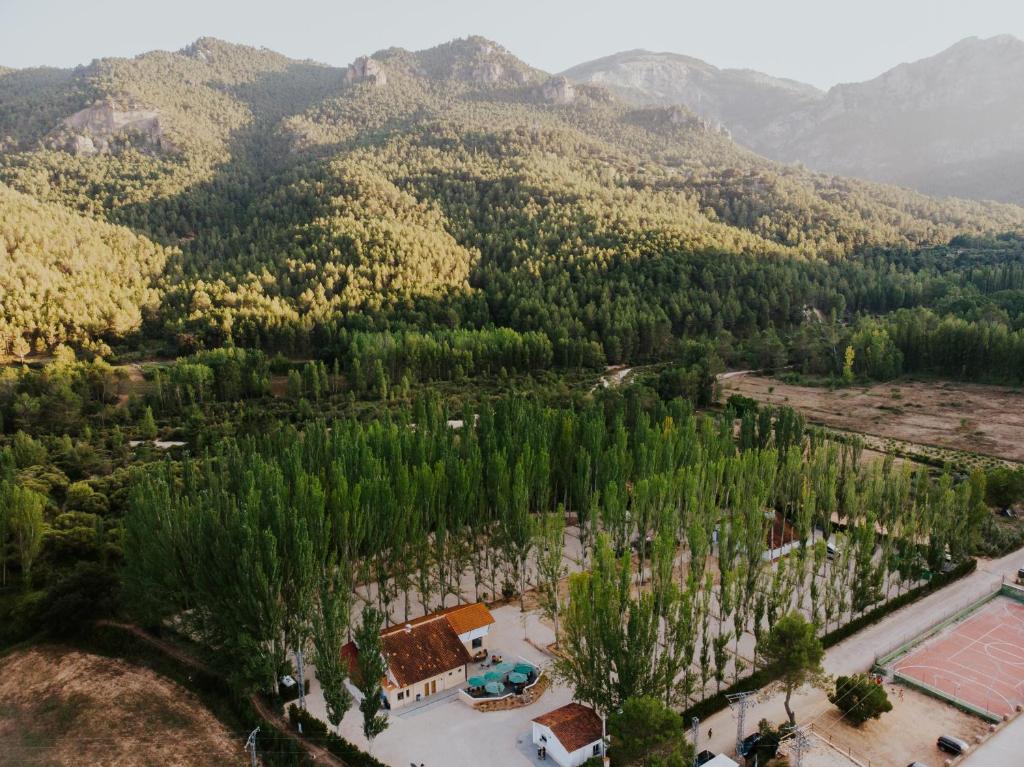 an aerial view of a resort in the mountains at Complejo Rural Rio Tus in Yeste