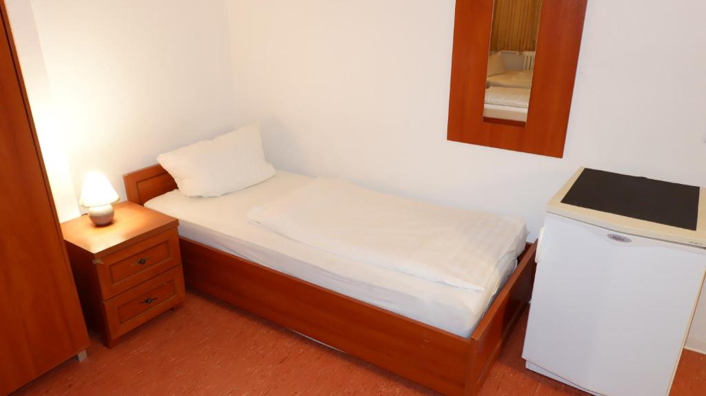 Postel nebo postele na pokoji v ubytování Hostel am Kurtti