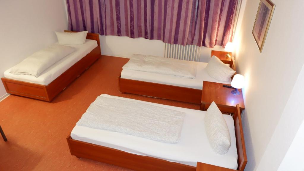 Postel nebo postele na pokoji v ubytování Hostel am Kurtti