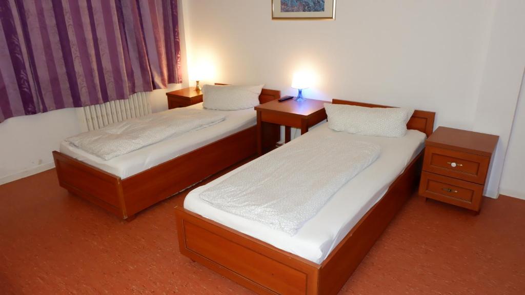 Postel nebo postele na pokoji v ubytování Hostel am Kurtti