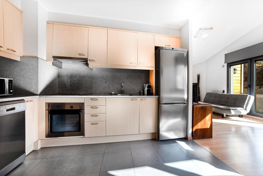 Kuchyň nebo kuchyňský kout v ubytování Apartaments El Floc