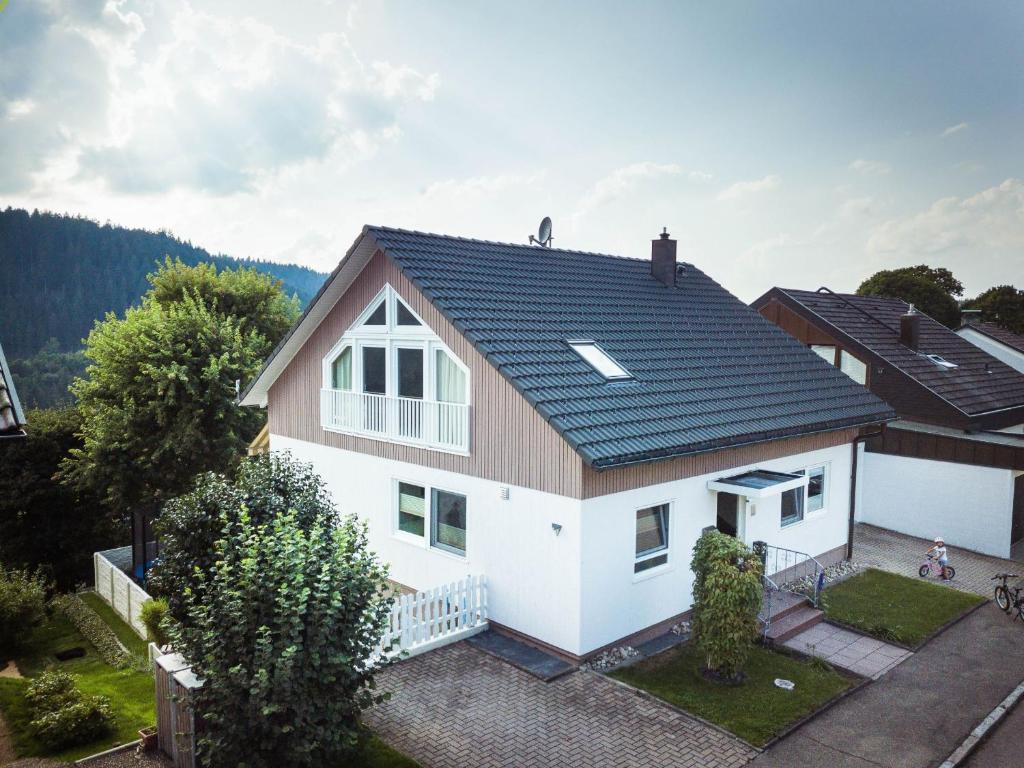 a white house with a black roof at Haus Talblick in Freudenstadt