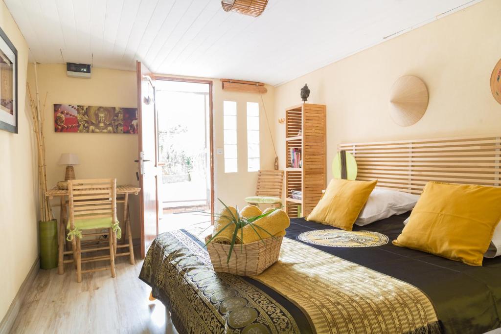 Postel nebo postele na pokoji v ubytování Maison d'hôtes L'îlot bambou