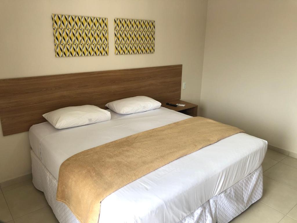 Postel nebo postele na pokoji v ubytování Hotel QualitySul