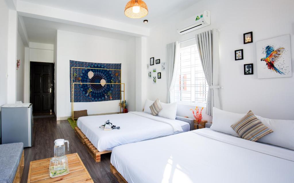 Postel nebo postele na pokoji v ubytování Nem's House Hội An