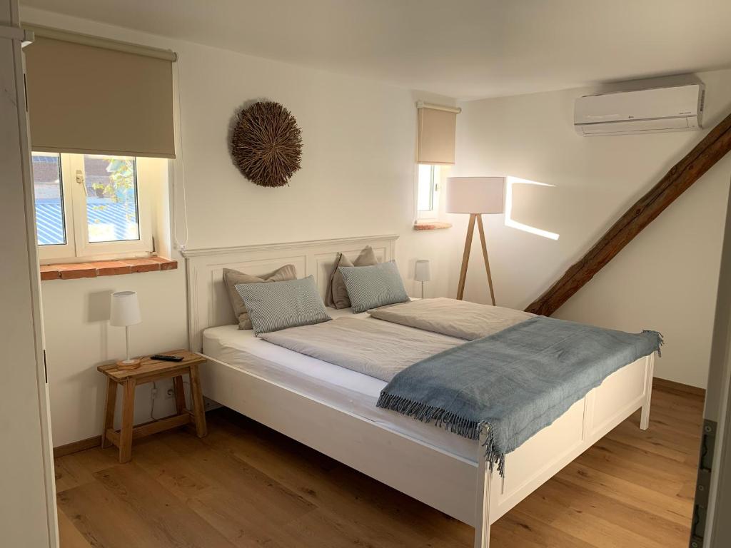 Postel nebo postele na pokoji v ubytování Logis 11 Apartments