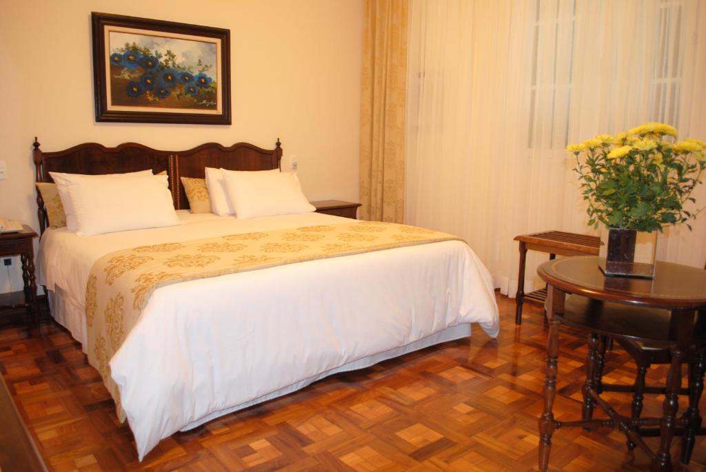 Postel nebo postele na pokoji v ubytování Hotel Glória Resort & Convention