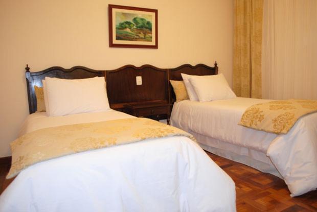 Postel nebo postele na pokoji v ubytování Hotel Glória Resort & Convention