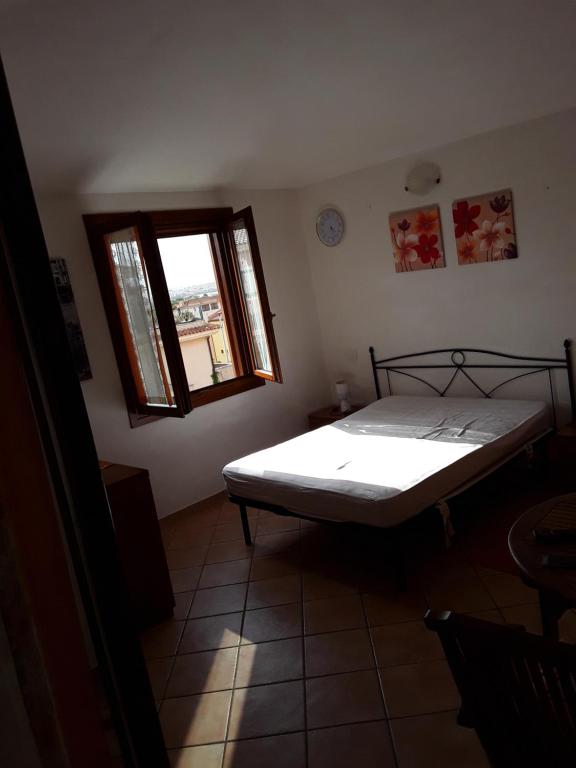 Кровать или кровати в номере Da Claudio gli oleandri residence