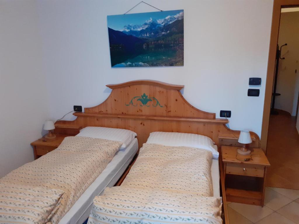 Postel nebo postele na pokoji v ubytování Appartamenti Rumo